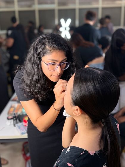 Teamwork is dream work. Here is one of my senior artists working on a model, showcasing the hands-on training our students receive at the academy.