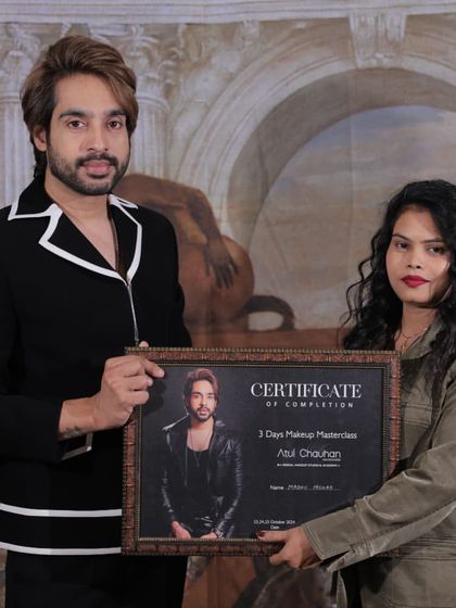 A happy graduate holding her certificate. It was a pleasure teaching her and seeing her talent grow.