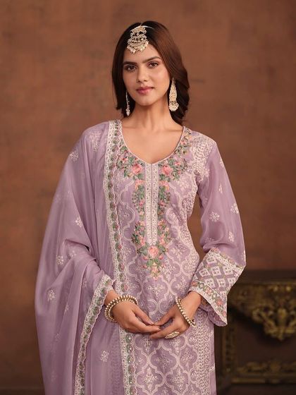 I love this soft lavender salwar kameez. The combination of white and pink thread embroidery on the organza fabric is just so pretty and perfect for a spring event.