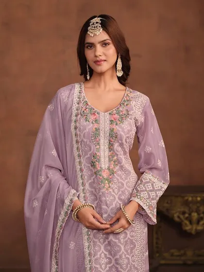 I love this soft lavender salwar kameez. The combination of white and pink thread embroidery on the organza fabric is just so pretty and perfect for a spring event.