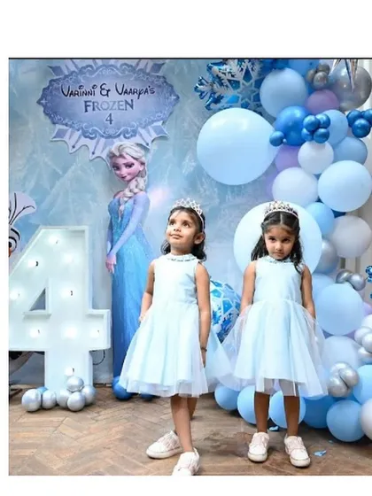 Let it go! We brought the magic of Arendelle to life for these two sisters celebrating their fourth birthday with our custom-made Frozen-themed dresses.