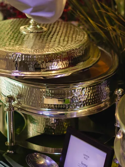 A close-up of our hammered silver chafing dish, showcasing the quality and elegance of our equipment. Even the functional elements of our service are chosen for their beauty.