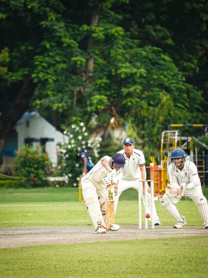 A tense moment behind the stumps. Our wicketkeepers are trained to be sharp and agile, playing a crucial role in the team's fielding performance.
