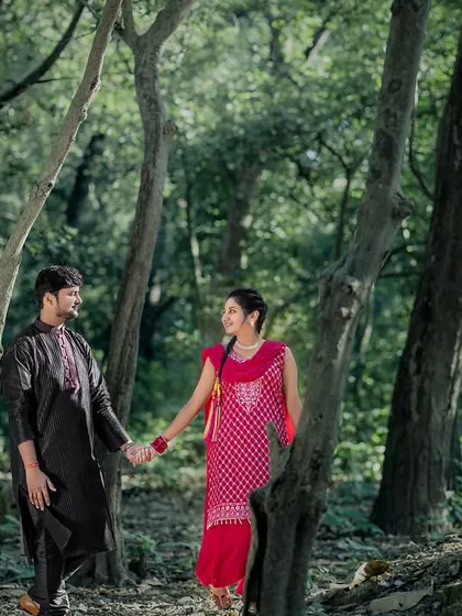 A walk through the woods in traditional attire. This shot combines the beauty of nature with the elegance of ethnic clothing for a unique pre-wedding photo.