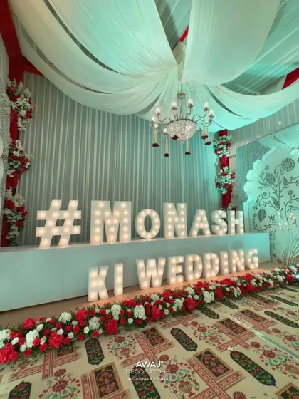 A close-up of the custom wedding hashtag sign, a modern and personal touch.