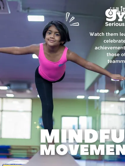 A young gymnast holds a graceful pose on the balance beam, demonstrating focus and control. Our mindful movement exercises teach children to celebrate their own achievements and those of their teammates.