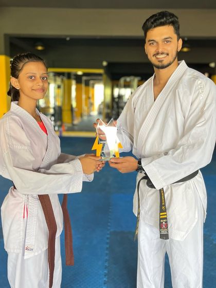 Awarding one of our "Best Fighter of the Year" trophies. This student has shown exceptional spirit and technique in sparring.