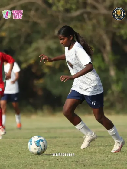Our player dribbles the ball down the wing, looking to create an attacking opportunity with speed and control.