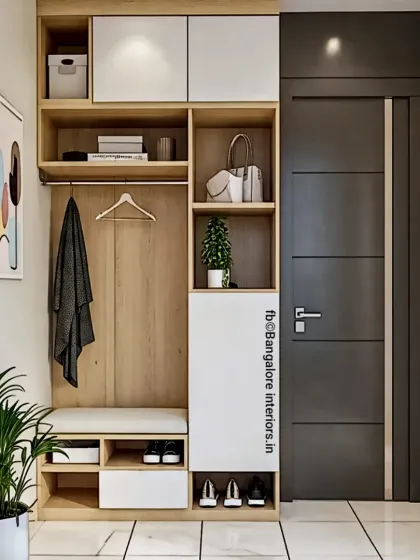 This entryway unit is a complete solution for keeping your home organized. It combines a cushioned seating bench, open shoe storage, hooks for coats and bags, and overhead cabinets for items you need to grab on your way out.