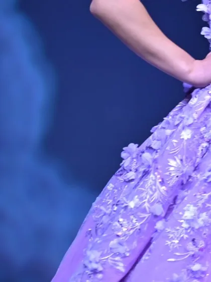 The fine craftsmanship of my GULFAM collection is evident in this close-up of the lavender gown's 3D floral embroidery.