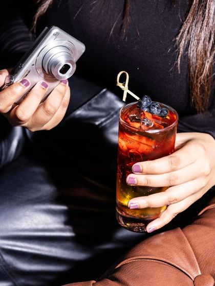 My mocktails are so photogenic, they often get their own photoshoot. Here, a guest captures a picture of a berry-filled drink before taking the first sip.