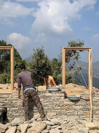The slow and steady process of stacking stone and setting timber frames for our guesthouses in the Himalayas. Each piece is placed by hand, a testament to the skill and patience of the craftspeople we work with.
