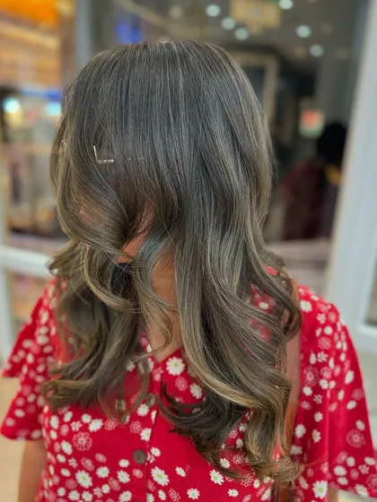 The back view of this ash blond look, showing the full effect of the cool-toned colour.