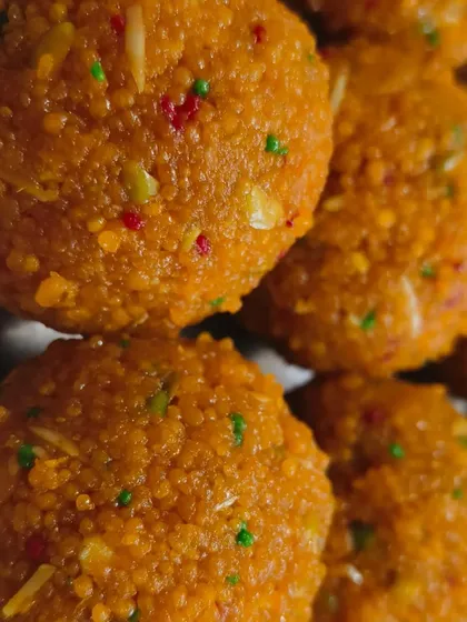 A close-up of my motichoor laddoos, showing the fine texture and rich colour. Each one is a small bite of happiness.