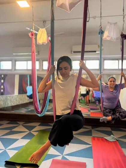 Our Saturday classes are a space for connection and shared energy. Here are two of my students finding their focus and strength together, each in their own hammock.