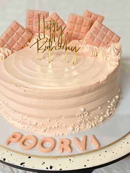 A repeat design of this popular pink chocolate bar cake, because our clients love it.