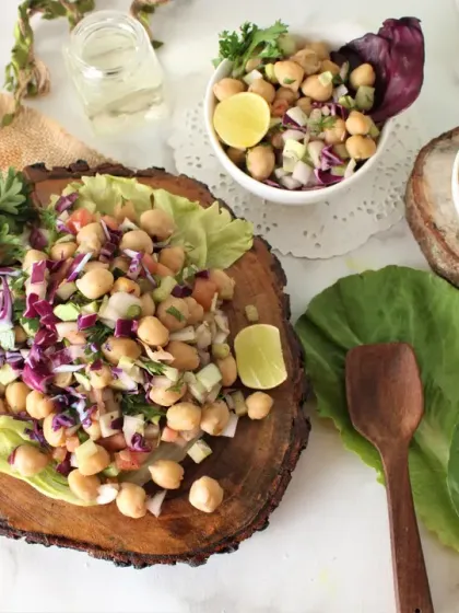 Our protein-packed chickpea salad is a favorite among clients. It's made with fresh chopped vegetables like cucumber, onions, and red cabbage, with a light dressing. It can be a part of your meal or a light lunch on its own.