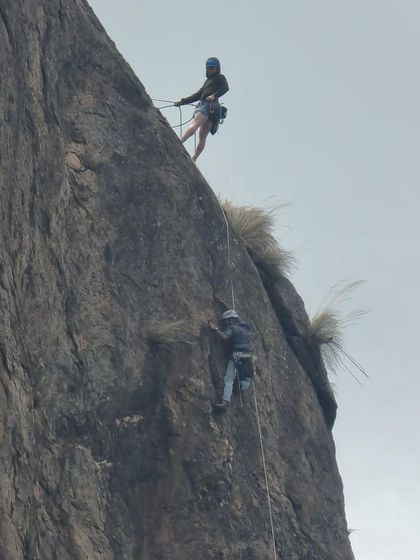 Two climbers rappelling down a steep face at Talai Betta. Safely getting down is just as important as getting up.