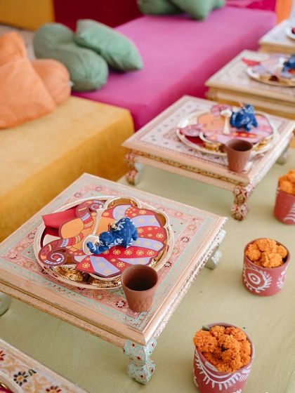 Low seating with traditional "bajot" tables for the Rajasthani-themed welcome lunch. The custom thalis and kulhads for chai added to the authentic, heartwarming charm of the gathering.