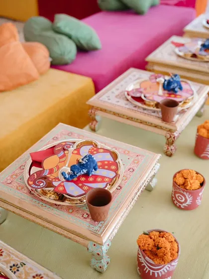 Low seating with traditional "bajot" tables for the Rajasthani-themed welcome lunch. The custom thalis and kulhads for chai added to the authentic, heartwarming charm of the gathering.
