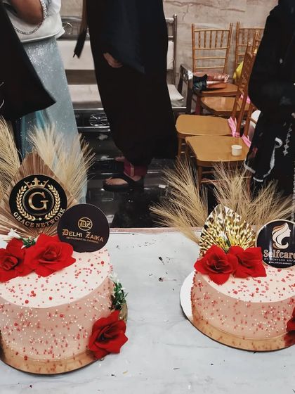 A shot of my sponsored cakes on display at the Grace Network exhibition. I designed these pink and red floral cakes to match the celebratory mood of the event.