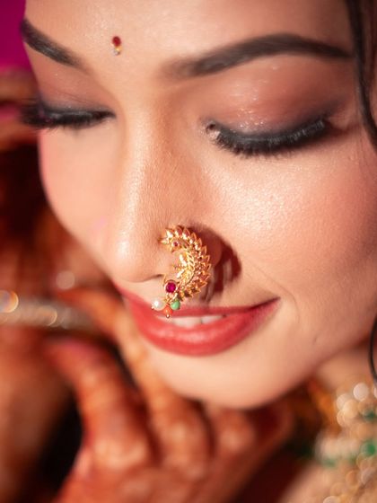 A close-up shot of a Maharashtrian bride's nath. I focus on these iconic details that are rich with cultural significance and add to the bride's traditional beauty.
