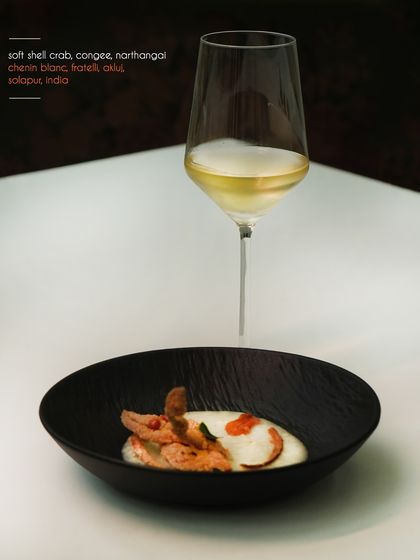 A dish from our limited-edition tasting menu with Fratelli wines. Here, soft shell crab with congee and narthangai is paired with Fratelli's Akluj Chenin Blanc. The wine's acidity and fruit notes cut through the richness of the crab, creating a balanced and memorable pairing.