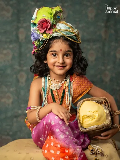 Let's bring imagination to life! This little one dressed as Krishna, complete with a pot of butter, shows how we can create playful and artistic themed portraits that are full of charm and personality.