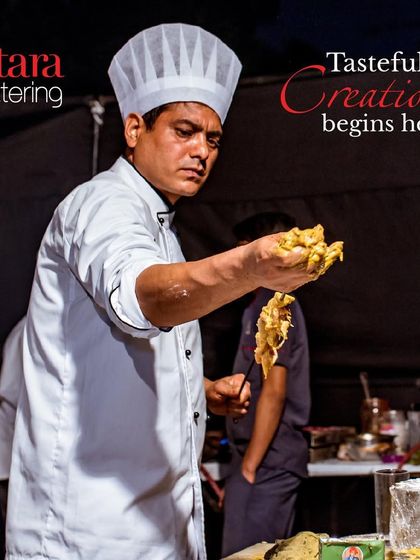 Tasteful creation begins here. This image captures the focus and expertise of our chef as he prepares food for an event, ensuring quality in every dish.