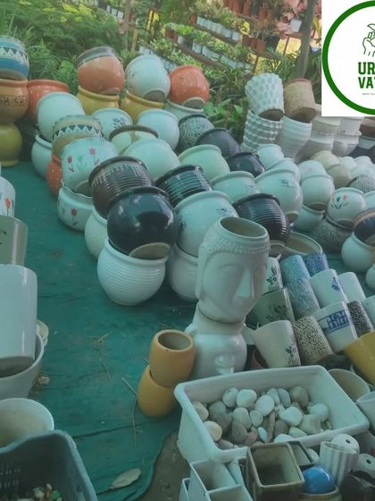 More decorative pots, including some with a Buddha head design.