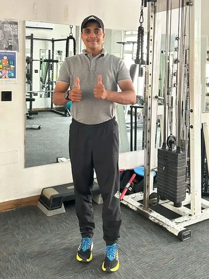 A thumbs-up after a solid set. Hard work always pays off.