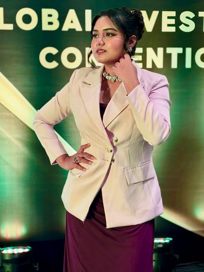A powerful pose at the Global Investment Convention. My formal wear is chosen to convey authority and elegance, suitable for an international audience.