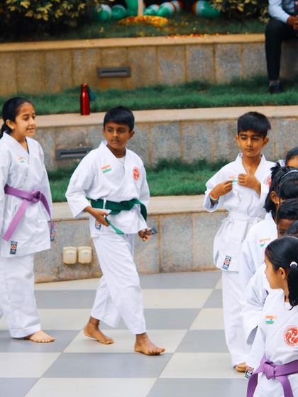 Students enter the training area in an orderly line, a small but important part of the discipline we teach. Respect for the dojo and the class structure begins the moment they arrive.