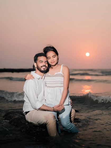 A quiet, intimate embrace as the sun sets over the water. These are the peaceful, romantic memories I aim to create and capture for you.