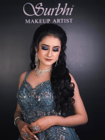 Another beautiful shot of the bride's blue eye makeup. This look is perfect for a bride who wants to make a statement at her engagement or cocktail party.