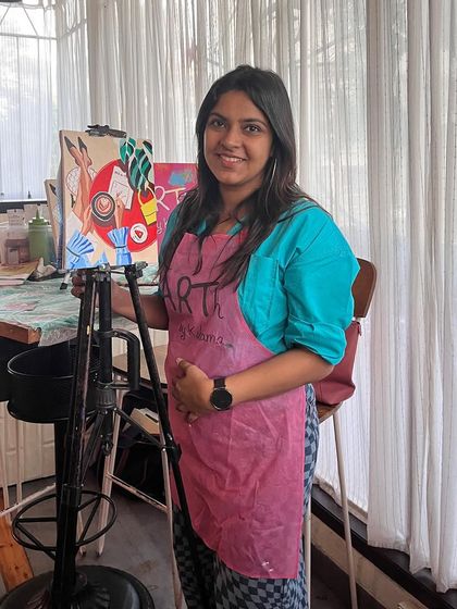 Here I am at a coffee and paint workshop, ready to guide the participants. I love hosting these relaxed and creative sessions.