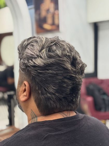 The back view of the salt and pepper haircut, showing the clean fade and textured top.