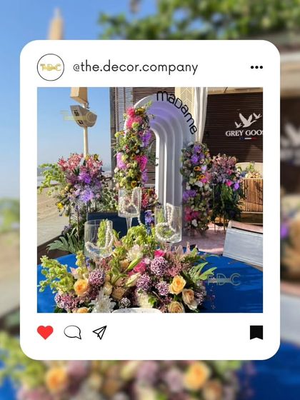 A social media style snapshot of our work for the Madame launch. The branded archway framed by vibrant flowers against the sea view created an iconic, Instagrammable moment for the event.