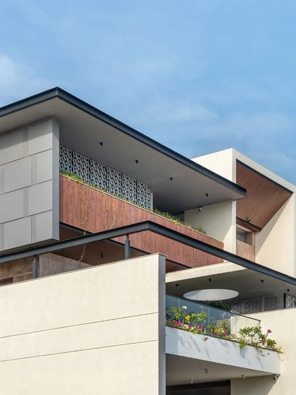 A detail of the upper levels, showing how balconies and screens are used to create private outdoor spaces for the residents.