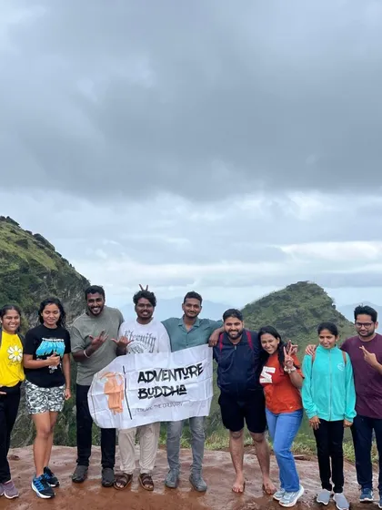 Another successful summit! Our group at the top of a peak in Chikmagalur, celebrating their trekking achievement together.