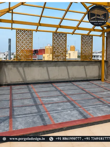 A closer look at the yellow pergola frame with decorative jali panels installed along the side. This shows how we incorporate custom design elements during the construction phase.