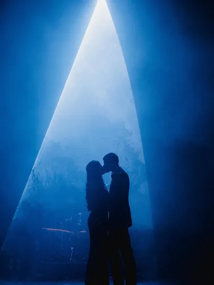 Creating that perfect, dreamy moment for a couple's first dance is my specialty. This silhouette shot captures the romance I help bring to life on stage, making it a memory you'll cherish forever.