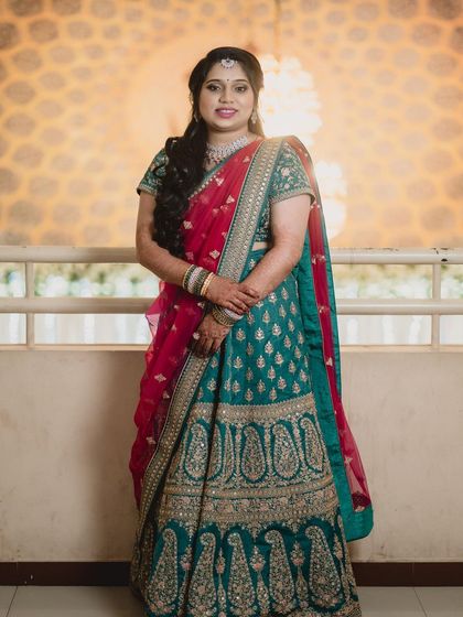 A full view of a gorgeous reception lehenga. I styled her with soft waves in her hair and makeup that enhances her features, ensuring she looks and feels her best for the party.