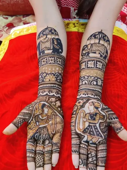 A close-up of the dandiya couple design, showing the fine details and shading that create a sense of movement.