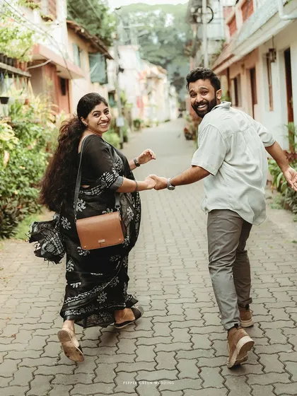 A joyful "follow me" shot through the charming streets of Fort Kochi. This pre-wedding session was about exploring and capturing their adventurous spirit.