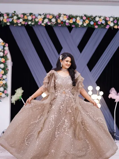 A reception look fit for a princess. This bride is wearing a magnificent golden gown, and I created a bold, glamorous makeup look with a nude lip to balance the sparkle of her outfit.