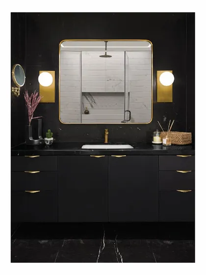 To complement the master bedroom, this bathroom is clad in black Marquina and custom white alabaster marble. The clean lines, balanced composition, and brass accents create a look of timeless luxury and sophistication.
