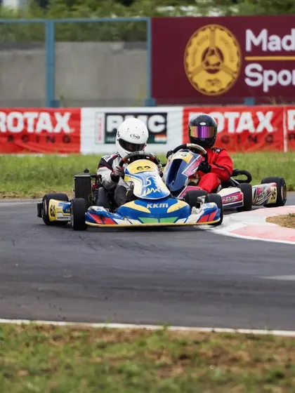 A tight battle between two karts at the Madras Motor Sports Club track during the RMC.