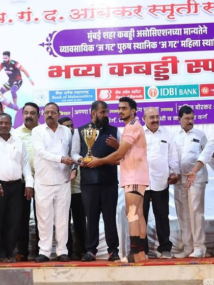 Another shot of our player being awarded the 'Best Player' trophy on stage.