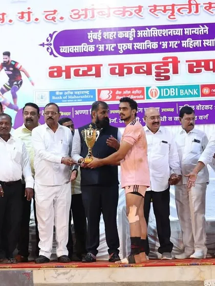 Another shot of our player being awarded the 'Best Player' trophy on stage.